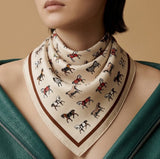 Person wearing a patterned scarf with a neutral background