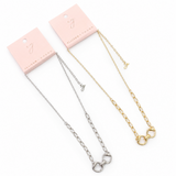 Two necklaces, one silver and one gold, on pink cards with 'Jewelry' branding.