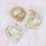 Juego de 4 pulseras de cuentas de piedra y madera.
