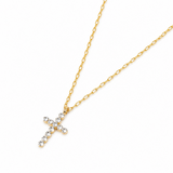 Gold necklace with a cross pendant on a white background