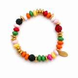 a bracelet with different colors and shapes of beads in festive mood. white background