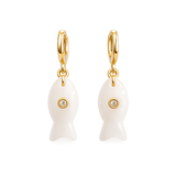 Gold fish-shaped earrings with white accents on a white background