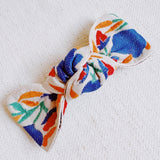 Elegant hair clip featuring intricate French floral embroidery on a soft fabric base—offering a timeless, romantic accent to any hairstyle.