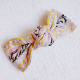 Elegant hair clip featuring intricate French floral embroidery on a soft fabric base—offering a timeless, romantic accent to any hairstyle.