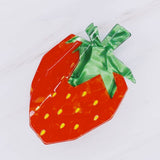 Cute and colorful strawberry-shaped hair claw clip with a glossy finish, perfect for adding a fresh and playful touch to any hairstyle.