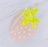 Cute and colorful strawberry-shaped hair claw clip with a glossy finish, perfect for adding a fresh and playful touch to any hairstyle.