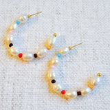 Stylish hoop earrings featuring freshwater pearls paired with colorful accent beads, creating a vibrant and chic look.