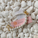 Pulsera de perlas con lazo colgante