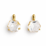Artistic drop earrings featuring prism-cut gemstones framed by lustrous gold-tone metal. The angular yet fluid silhouette captures light beautifully, making each pair an elegant statement piece.