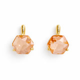 Artistic drop earrings featuring prism-cut gemstones framed by lustrous gold-tone metal. The angular yet fluid silhouette captures light beautifully, making each pair an elegant statement piece.
