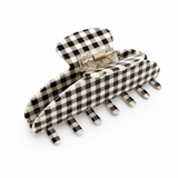 Black and white checkered hair clip on a white background