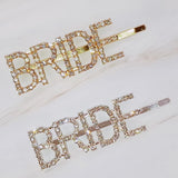 Elegant set of two gold and silver hair pins featuring sparkling "Bride" lettering and glam crystal accents—perfect for bridal showers, bachelorette parties, or wedding day styling.