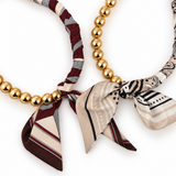 Ellison + Young Golden Bead Scarf-Tie Necklace in Brown and Beige – polished gold-tone beads paired with printed scarf fabric tied in a front knot