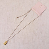 Elegant two-tone necklace featuring a sleek rectangular gold bar pendant on a silver-metal chain, blending modern edge with classic shine