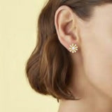 Gold-tone floral stud earrings featuring a luminous pearl center surrounded by petal-shaped sections adorned with sparkling crystals. The earrings create a radiant, feminine look that blends timeless charm with elegant shine.