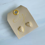Gold heart-shaped stud earring adorned with sparkling crystals. The design offers a timeless, lovely touch with a delicate shine perfect for everyday wear or special occasions.