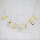 Brass gold necklace with multiple shell and sea charms