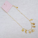 Brass gold necklace with multiple shell and sea charms
