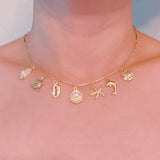 Brass gold necklace with multiple shell and sea charms