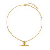 A polished gold chain necklace featuring a T-bar pendant drop at the center. The design highlights a modern, structured silhouette with timeless charm and a subtle statement finish