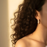 Elegant dangle earrings featuring a graduated design of genuine freshwater pearls in descending sizes. These classic and sophisticated earrings bring a timeless touch to any outfit, perfect for both everyday wear and special occasions.
