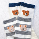 Adorable set of two socks featuring cheerful bear graphics and playful text—adding a fun and cozy vibe to any casual outfit.