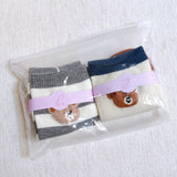 Adorable set of two socks featuring cheerful bear graphics and playful text—adding a fun and cozy vibe to any casual outfit.