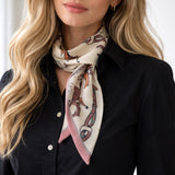 Woman wearing a black shirt with a patterned scarf around her neck.