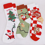 Set of three festive socks featuring holiday-themed designs, including Christmas colors and cheerful patterns, perfect for a cozy and jolly look.