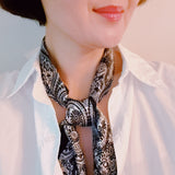 Set of two scrunchies featuring classic bandana scarf designs in nautical-inspired prints—combining style and function for a coastal, carefree look.