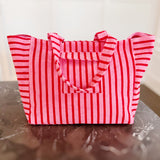 Oversized beach bag made from plush terry cloth material, designed with sturdy handles and a spacious interior—perfect for carrying towels, swimwear, and summer essentials in cozy, absorbent style.