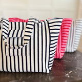 Oversized beach bag made from plush terry cloth material, designed with sturdy handles and a spacious interior—perfect for carrying towels, swimwear, and summer essentials in cozy, absorbent style.