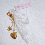 White lace ribbon bag charm with dangling gold heart charm – romantic vibe
