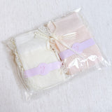 Set of two socks with lace detailing and satin bow accents at the back, offering a romantic and elegant touch to everyday looks.