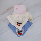 Set of two square hair scrunchies featuring cherry print and love-themed designs.