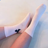Set of three socks each featuring a charming bow detail on the back, adding a sweet and feminine accent to any look.