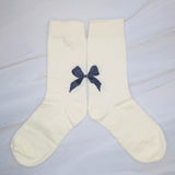 Set of three socks each featuring a charming bow detail on the back, adding a sweet and feminine accent to any look.