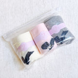 Set of three socks each featuring a charming bow detail on the back, adding a sweet and feminine accent to any look.