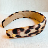 Chic and bold headband crafted from smooth satin fabric with a stylish leopard print—perfect for adding a touch of luxe and wild flair to any outfit.