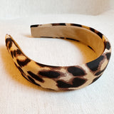 Chic and bold headband crafted from smooth satin fabric with a stylish leopard print—perfect for adding a touch of luxe and wild flair to any outfit.