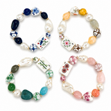 Set of four colorful beaded bracelets on a white background