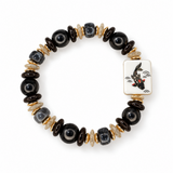 A beaded stretch bracelet featuring glossy black round beads, polished gold and cream metallic spacers, and a square white tile charm with a black and red fish design, shown on a plain white background.
