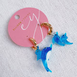 Dolphin-themed earrings featuring a dolphin design in a graceful, curved shape—perfect for a sweet, ocean-inspired look.