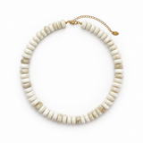 A chunky beaded collar necklace made of irregular, disc-shaped beads in off-white and light beige with natural marbling, finished with a gold-tone chain extender clasp on a solid white background.