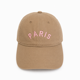 Brown cap with 'PARIS' embroidered in pink on a white background