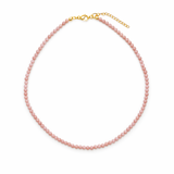 Single strand necklace featuring natural stone beads in warm, earthy tones with subtle color variations and organic shapes, offering a bohemian and grounded look perfect for everyday wear or layering.