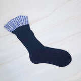 Elegant plaid socks featuring delicate ruffle trim at the top—combining classic style with a chic, feminine twist.