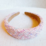 Elegant headband crafted from soft pastel tweed fabric with subtle texture and charm—perfect for a polished, feminine look with a hint of vintage flair.