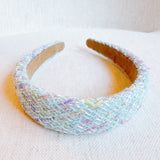 Elegant headband crafted from soft pastel tweed fabric with subtle texture and charm—perfect for a polished, feminine look with a hint of vintage flair.