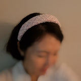Elegant headband crafted from soft pastel tweed fabric with subtle texture and charm—perfect for a polished, feminine look with a hint of vintage flair.